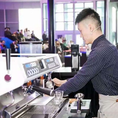 Hotelex Barista making coffee